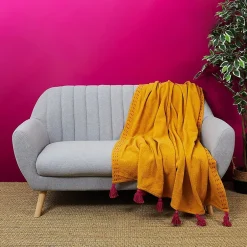 The Home Deco Factory Jeté de canapé surpiqué pompons jaune 130x150 cm