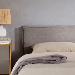 Idimex Tête de lit KLAO 160 sur pieds, en tissu - Gris